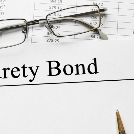 paper-with-surety-bond-on-a-table-picture-id657428174